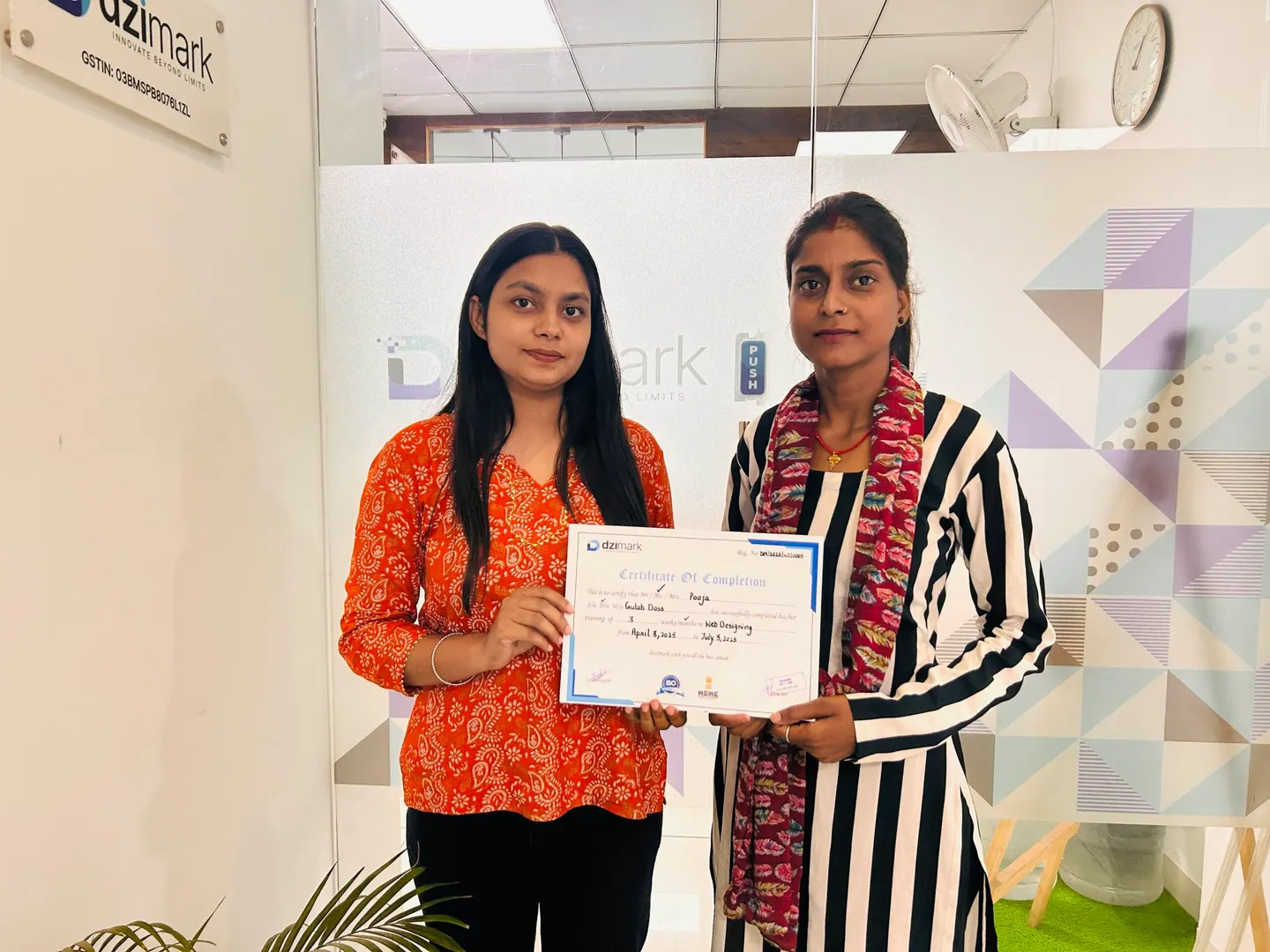 A Dzimark student receiving a training certificate at the Dzimark office