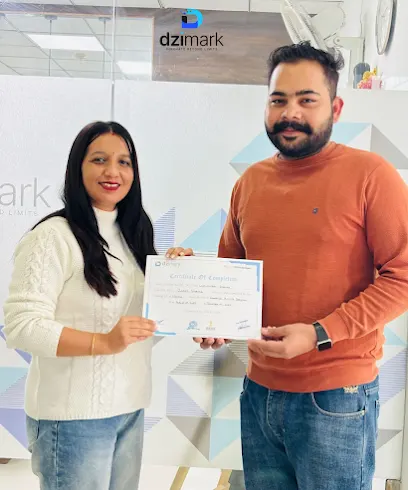 A Dzimark student receiving a certificate of completion at the Dzimark office