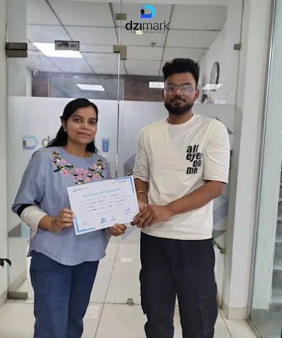 A Dzimark student receiving a certificate of completion outside Office 401